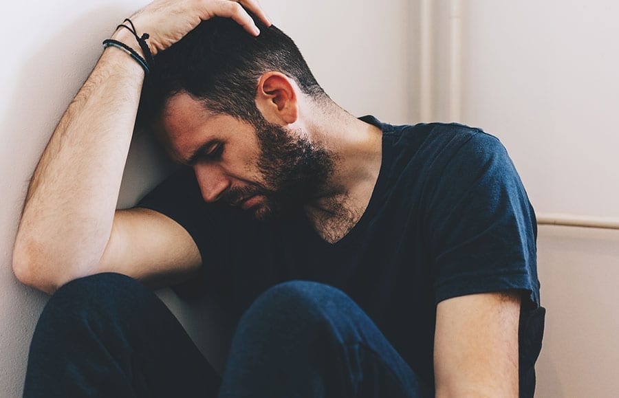 Man struggling with physical and psychological dependence