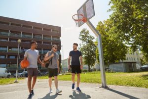 young men playing basketball in sober living near Poway