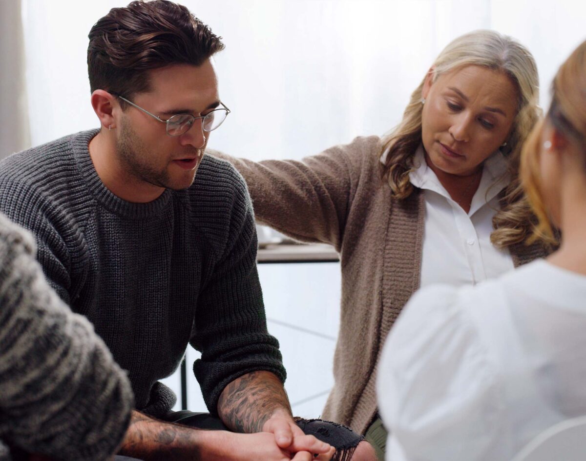 Family group discussing how to navigate shame and addiction
