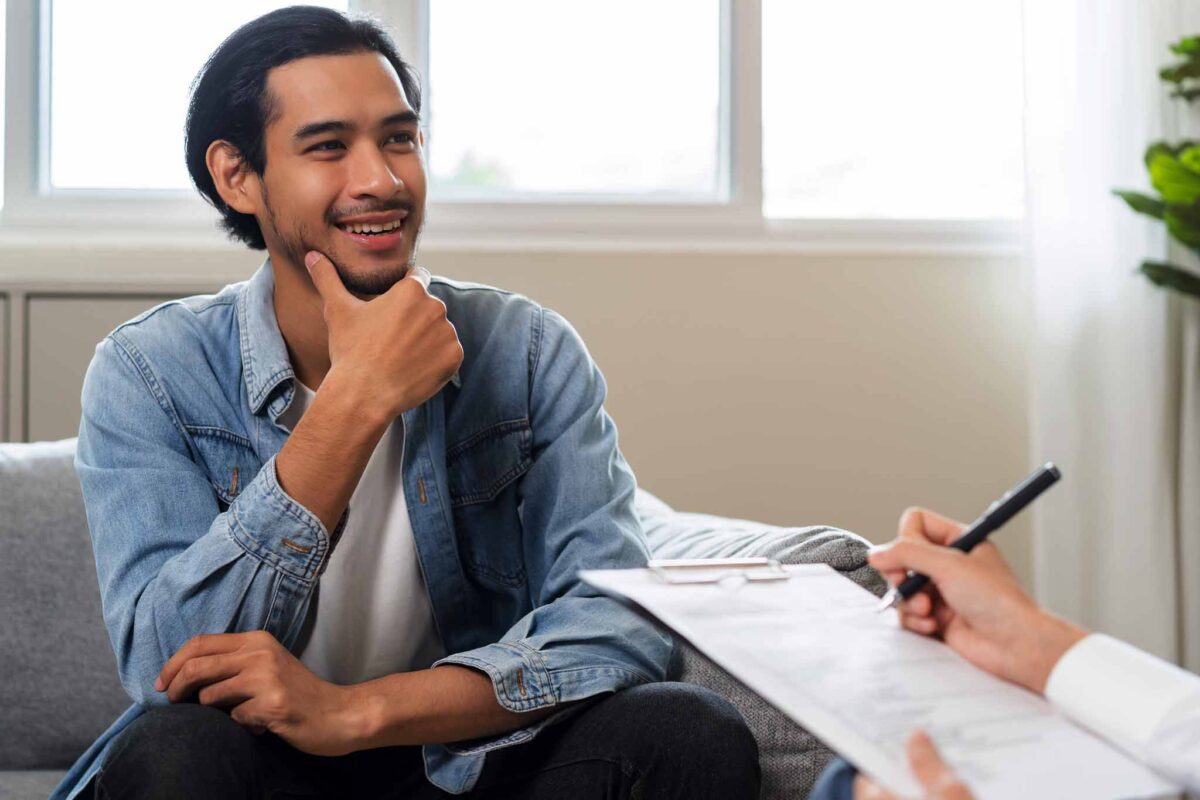 young man meeting with a therapist for alcohol addiction treatment