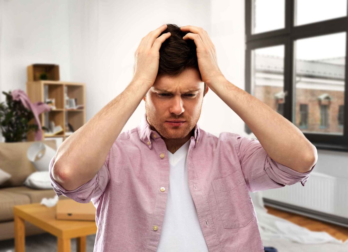 young man struggling with physical symptoms of addiction