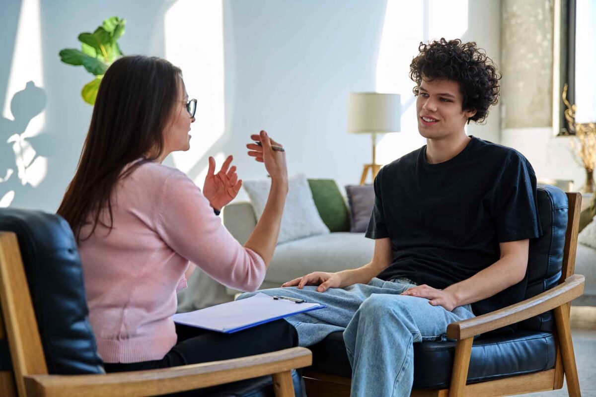 young man meeting with a psychiatrist for alcohol addiction