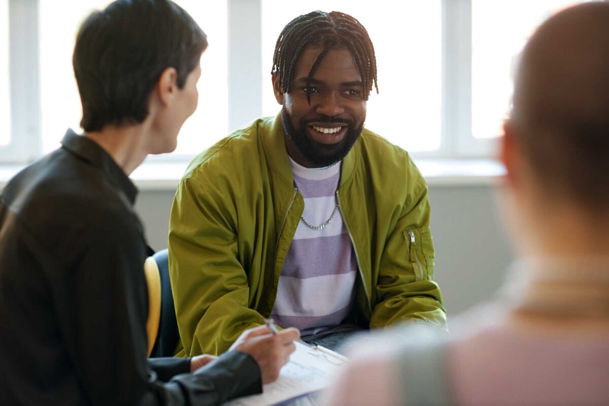 young man struggling with addiction learning about treatment approaches